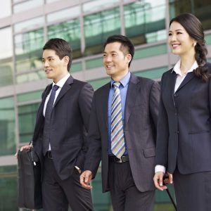 team of asian business people with modern building background.